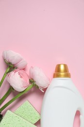 Photo of Spring cleaning. Detergent, sponges and flowers on pink background, flat lay. Space for text