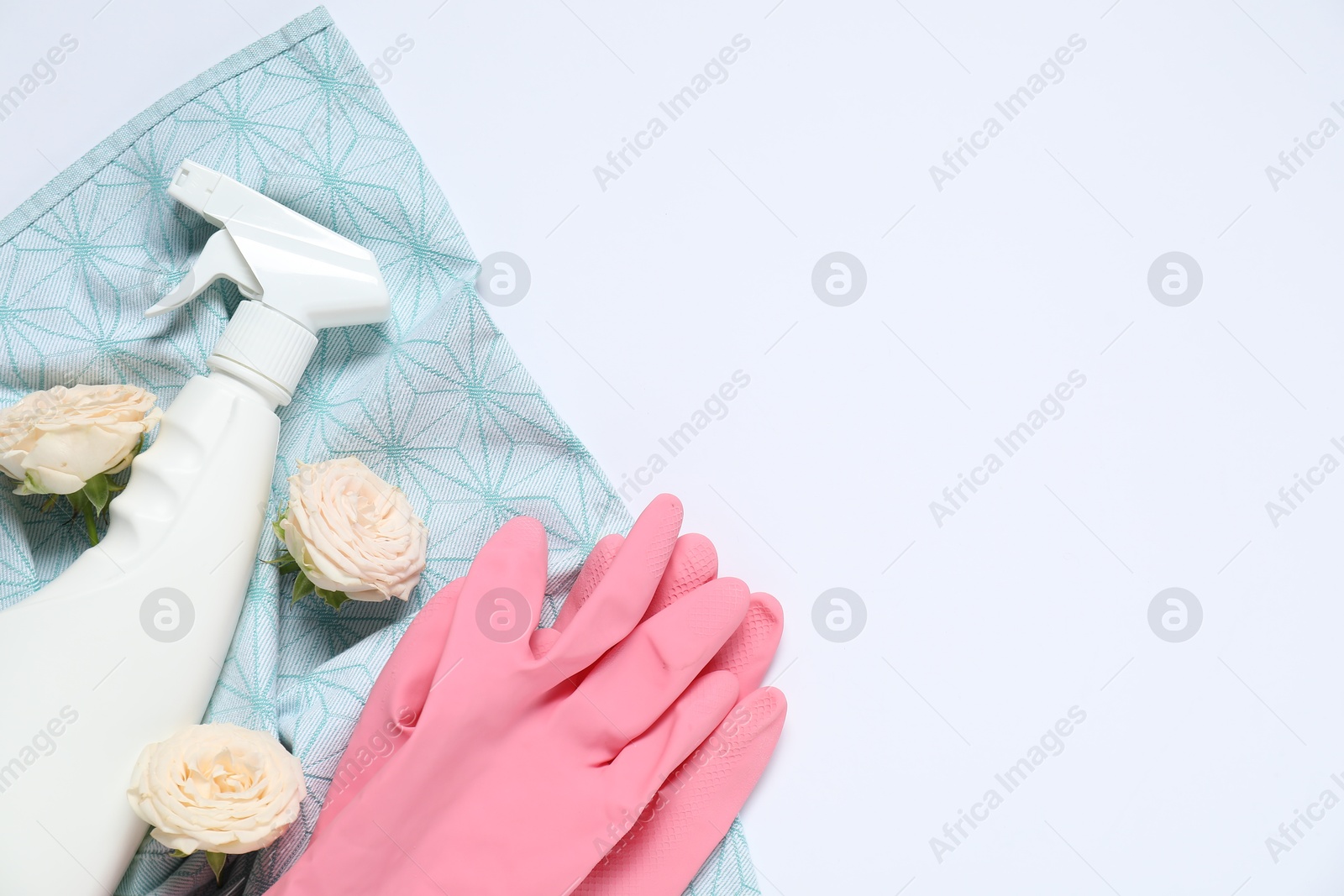 Photo of Spring cleaning. Detergent, supplies and flowers on white background, flat lay. Space for text