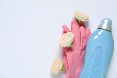 Photo of Spring cleaning. Detergent, gloves and flowers on white background, flat lay. Space for text