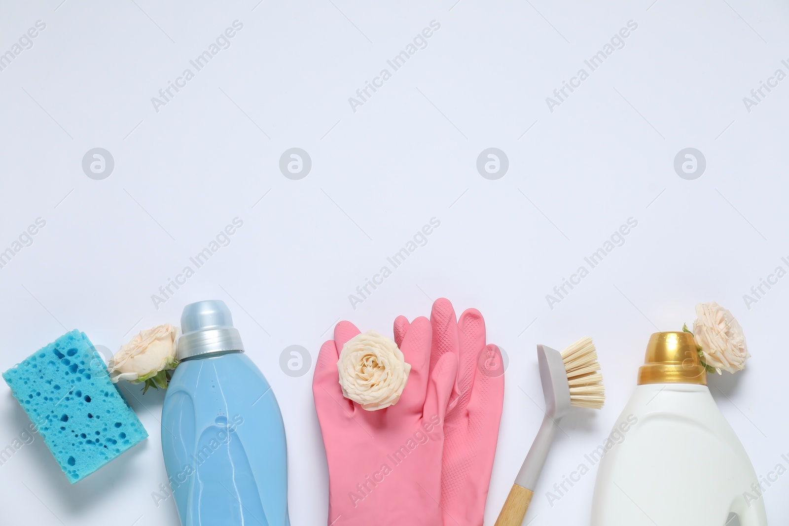 Photo of Spring cleaning. Detergents, supplies and flowers on white background, flat lay. Space for text