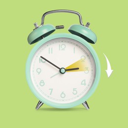 Image of Daylight saving time. Turquoise alarm clock on light green background. Highlighted area and arrow showing time change by one hour forward