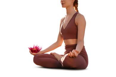 Woman meditating with beautiful lotus flower in her hand on white background. Padmasana (yoga lotus position)