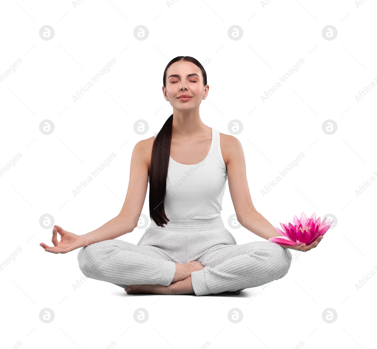 Image of Woman meditating with beautiful lotus flower in her hand on white background. Padmasana (yoga lotus position)