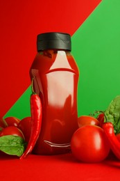 Photo of Ketchup, tomatoes, chili peppers and spinach on color background