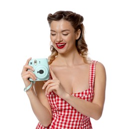 Photo of Happy pin-up woman with camera on white background