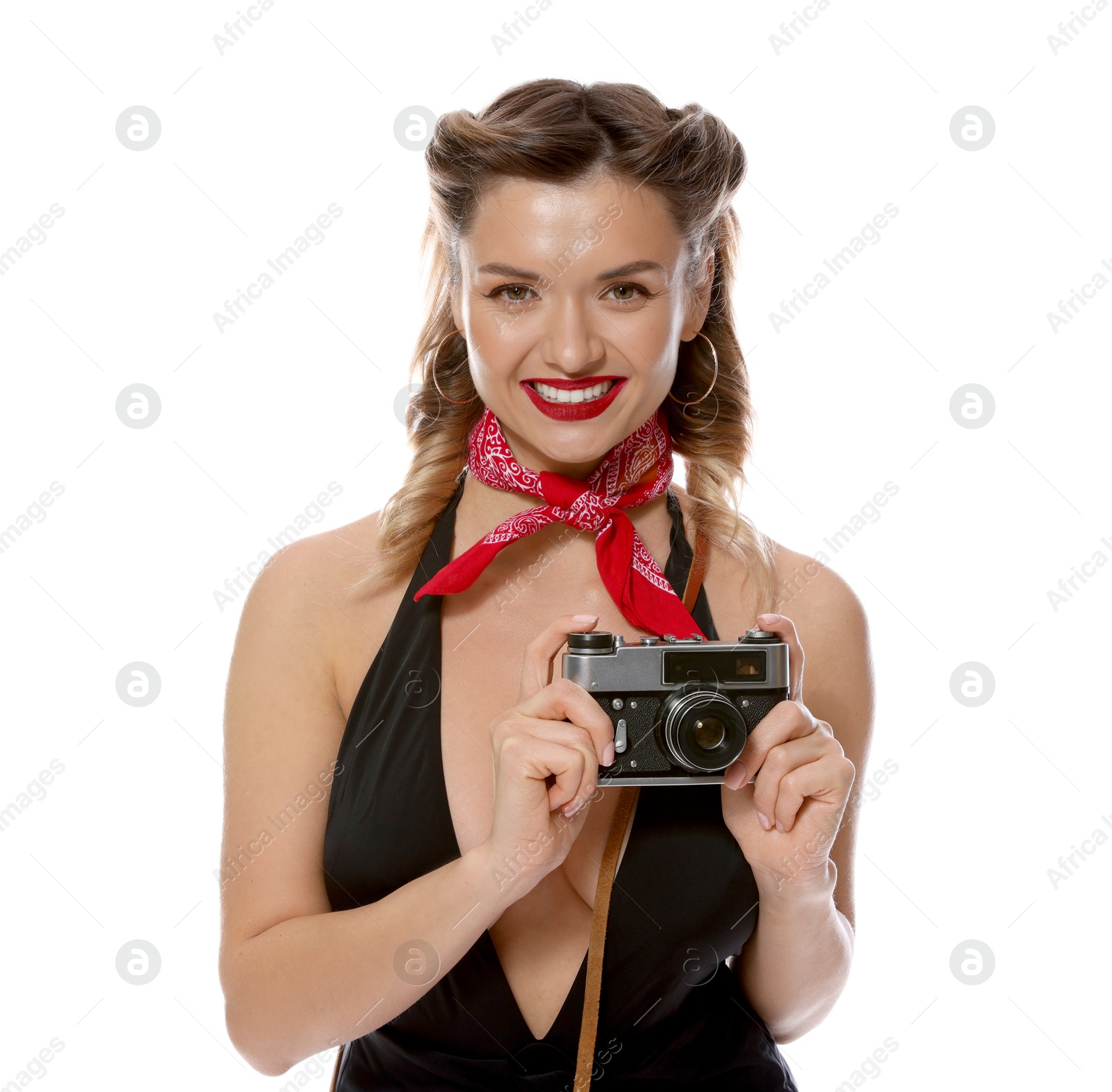 Photo of Happy pin-up woman with vintage camera on white background