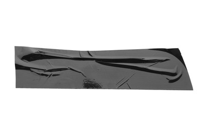 Photo of Strip of black adhesive tape isolated on white, top view