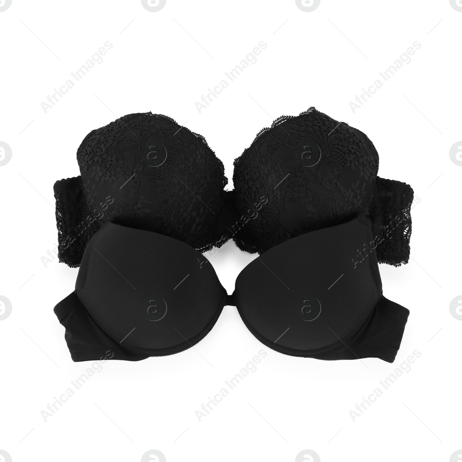 Photo of Two different beautiful bras isolated on white, top view