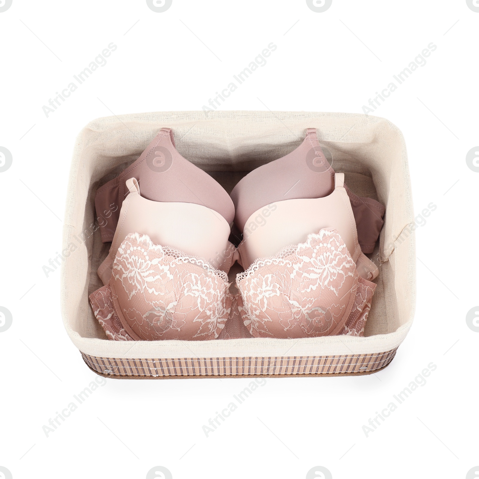 Photo of Beautiful bras in box isolated on white