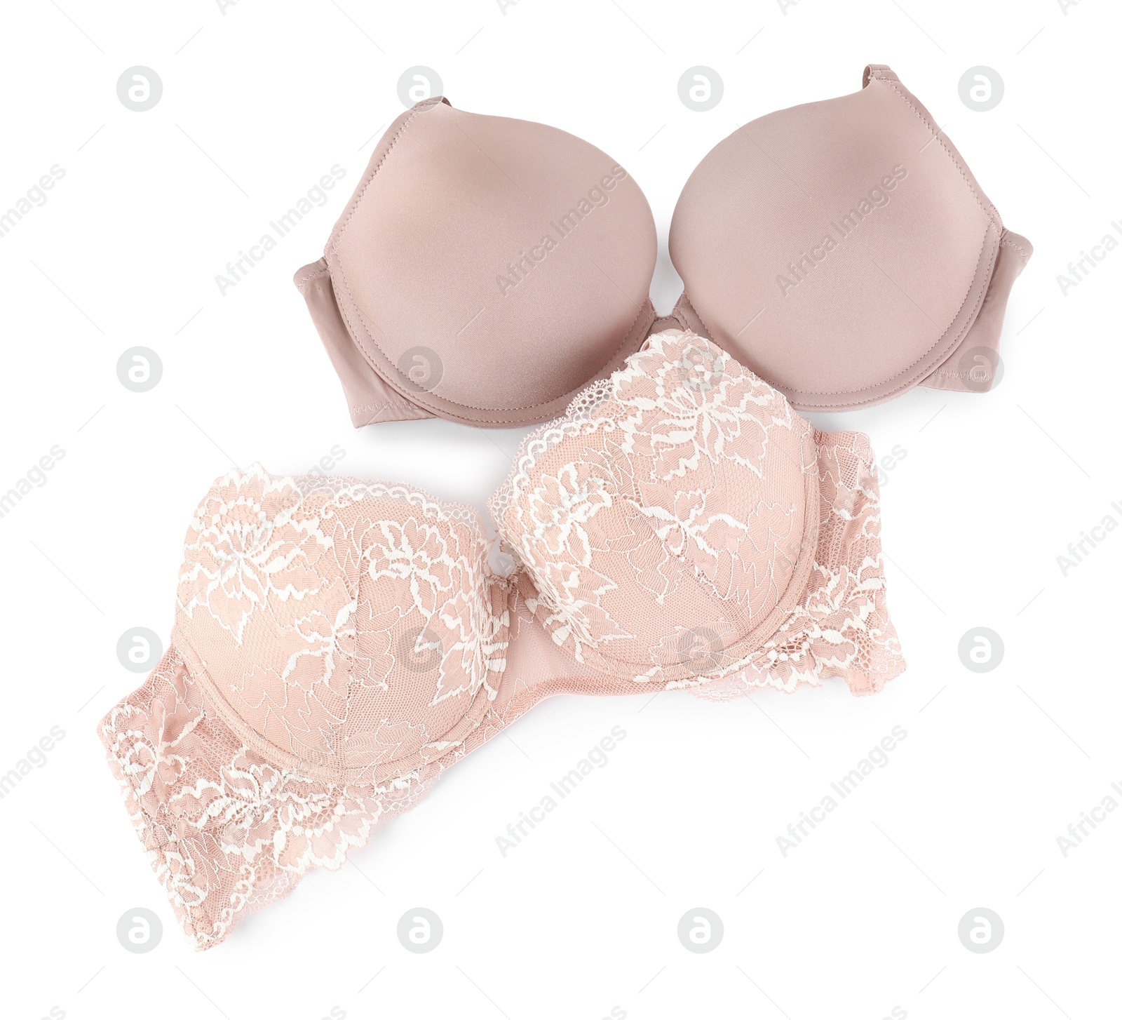 Photo of Two different beautiful bras isolated on white, top view