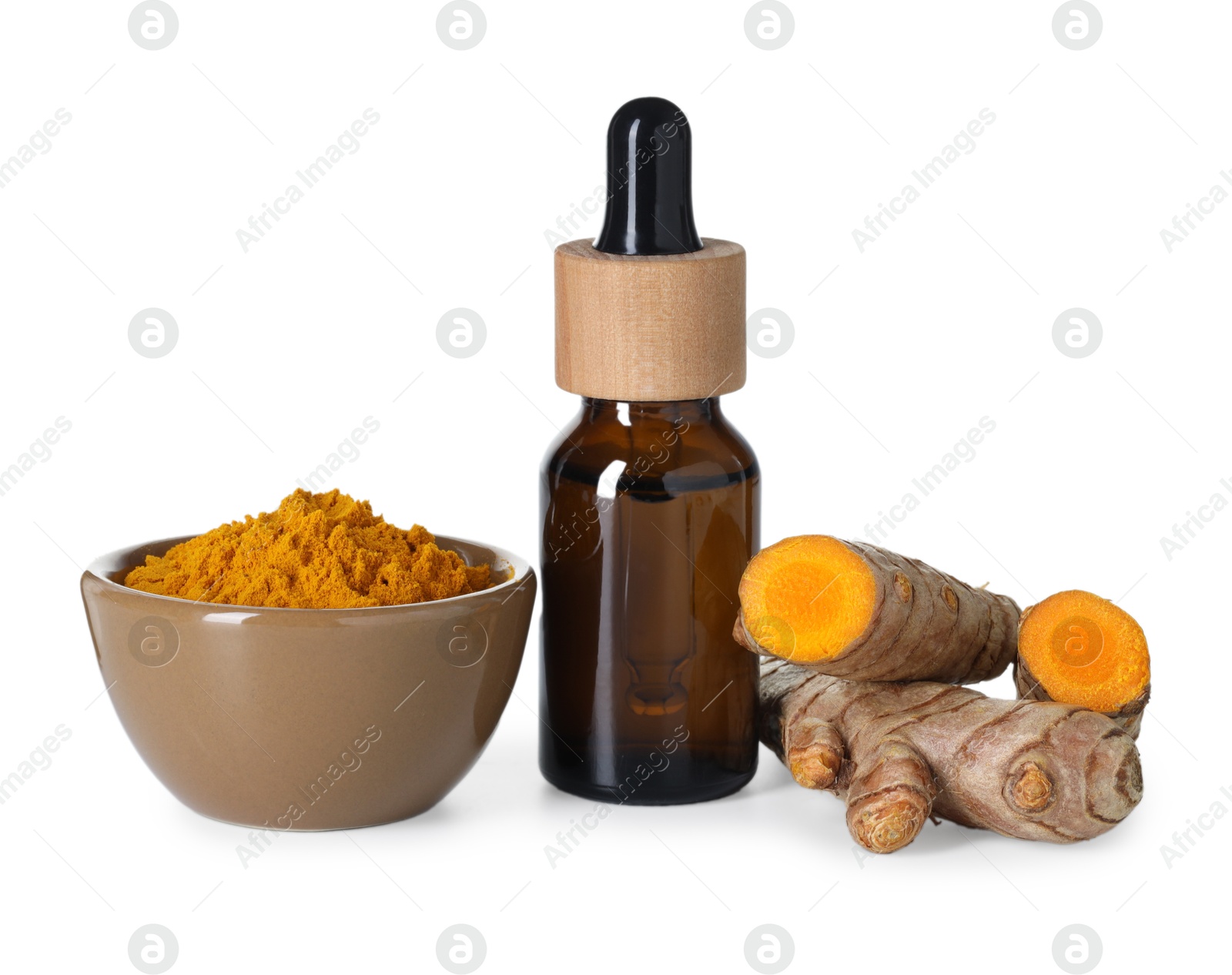 Photo of Bottle of turmeric essential oil, powder and raw roots isolated on white