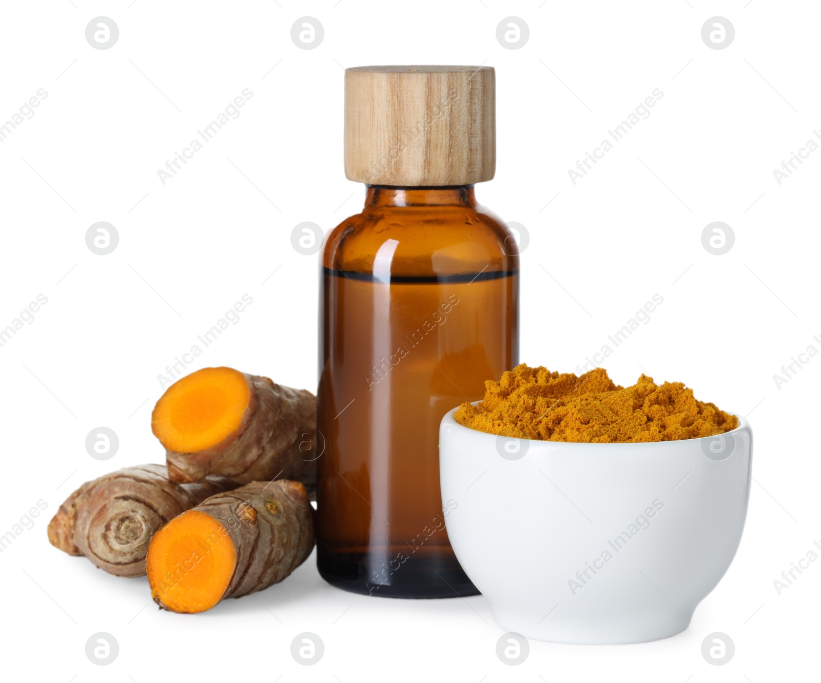 Photo of Bottle of turmeric essential oil, powder and raw roots isolated on white