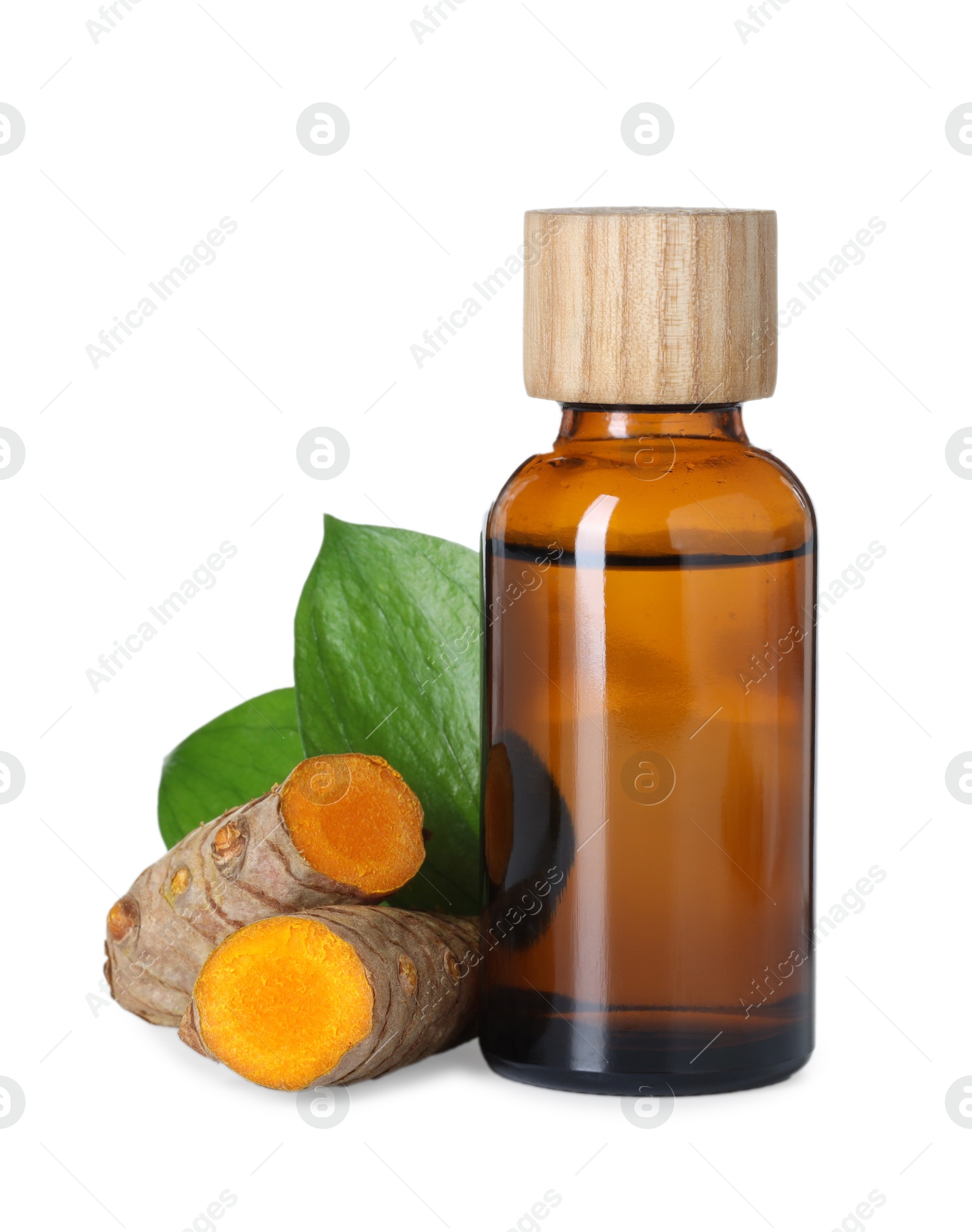 Photo of Bottle of turmeric essential oil, raw roots and leaves isolated on white