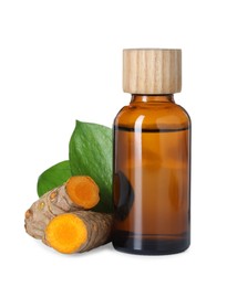 Photo of Bottle of turmeric essential oil, raw roots and leaves isolated on white