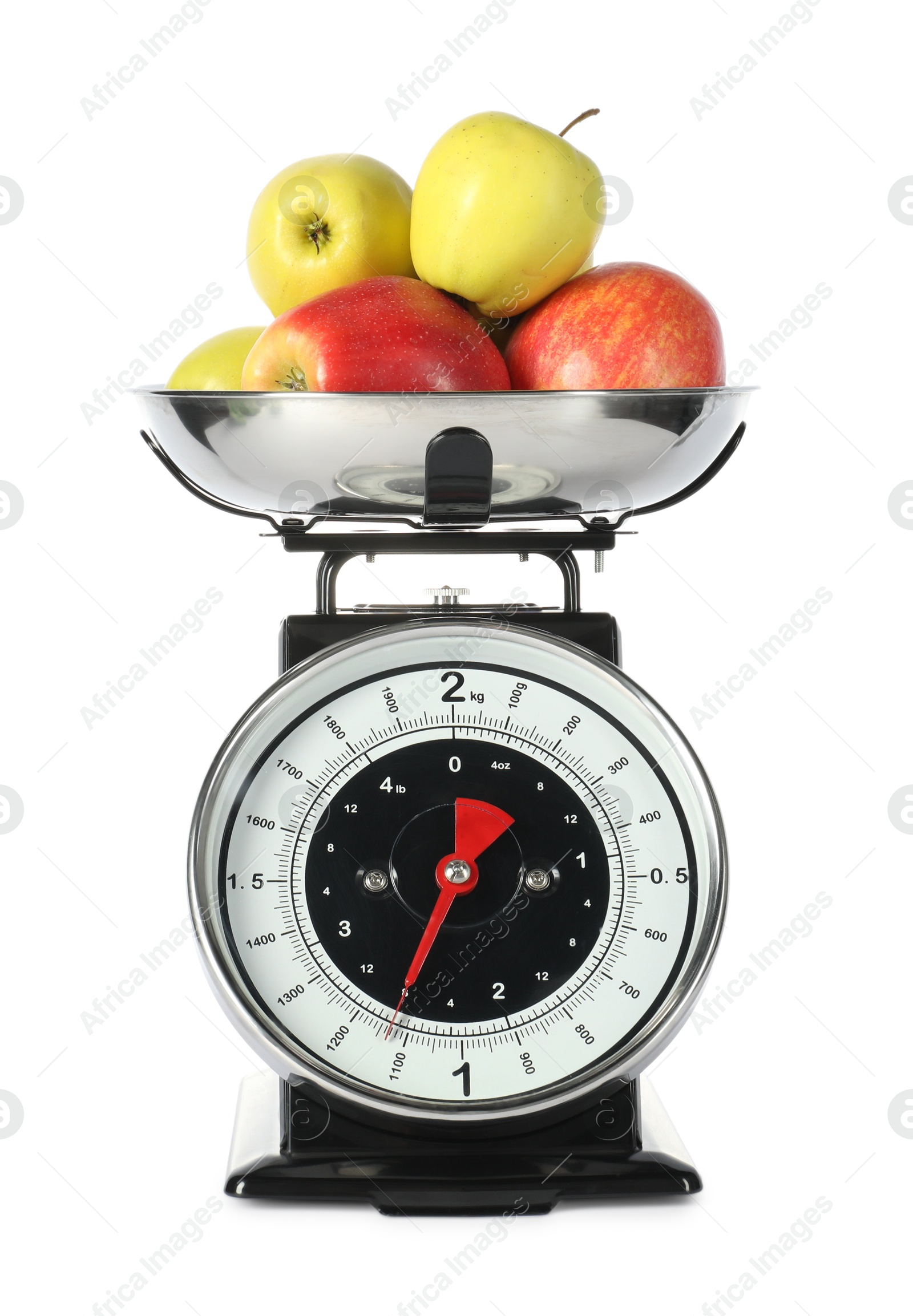 Photo of Retro mechanical kitchen scale with apples isolated on white