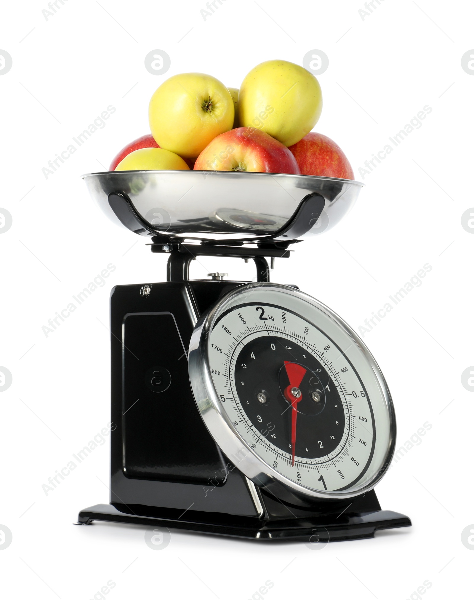 Photo of Retro mechanical kitchen scale with apples isolated on white