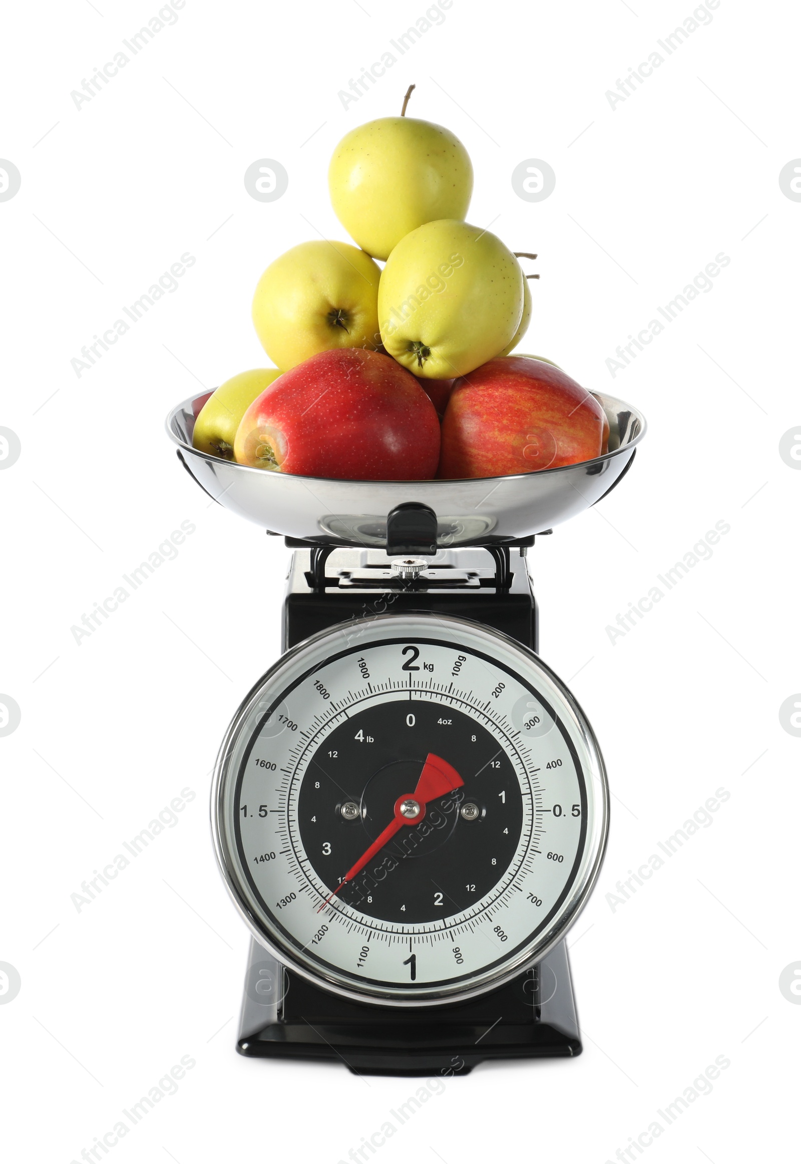 Photo of Retro mechanical kitchen scale with apples isolated on white