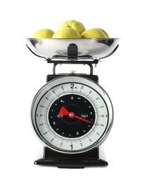 Photo of Retro mechanical kitchen scale with apples isolated on white