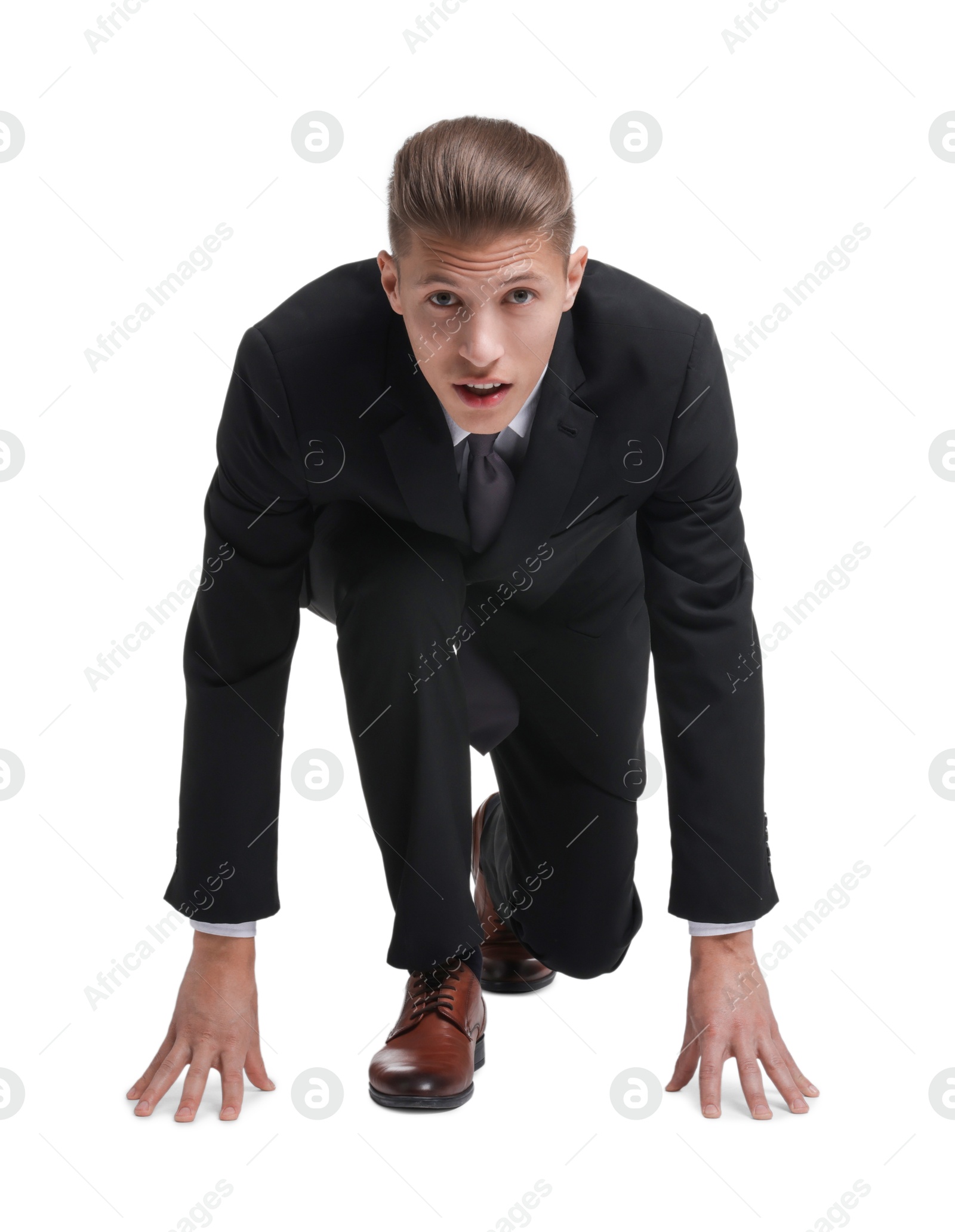 Photo of Businessman in starting position for run ready for competition on white background