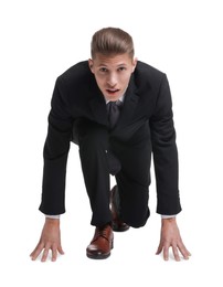 Businessman in starting position for run ready for competition on white background