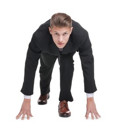 Businessman in starting position for run ready for competition on white background