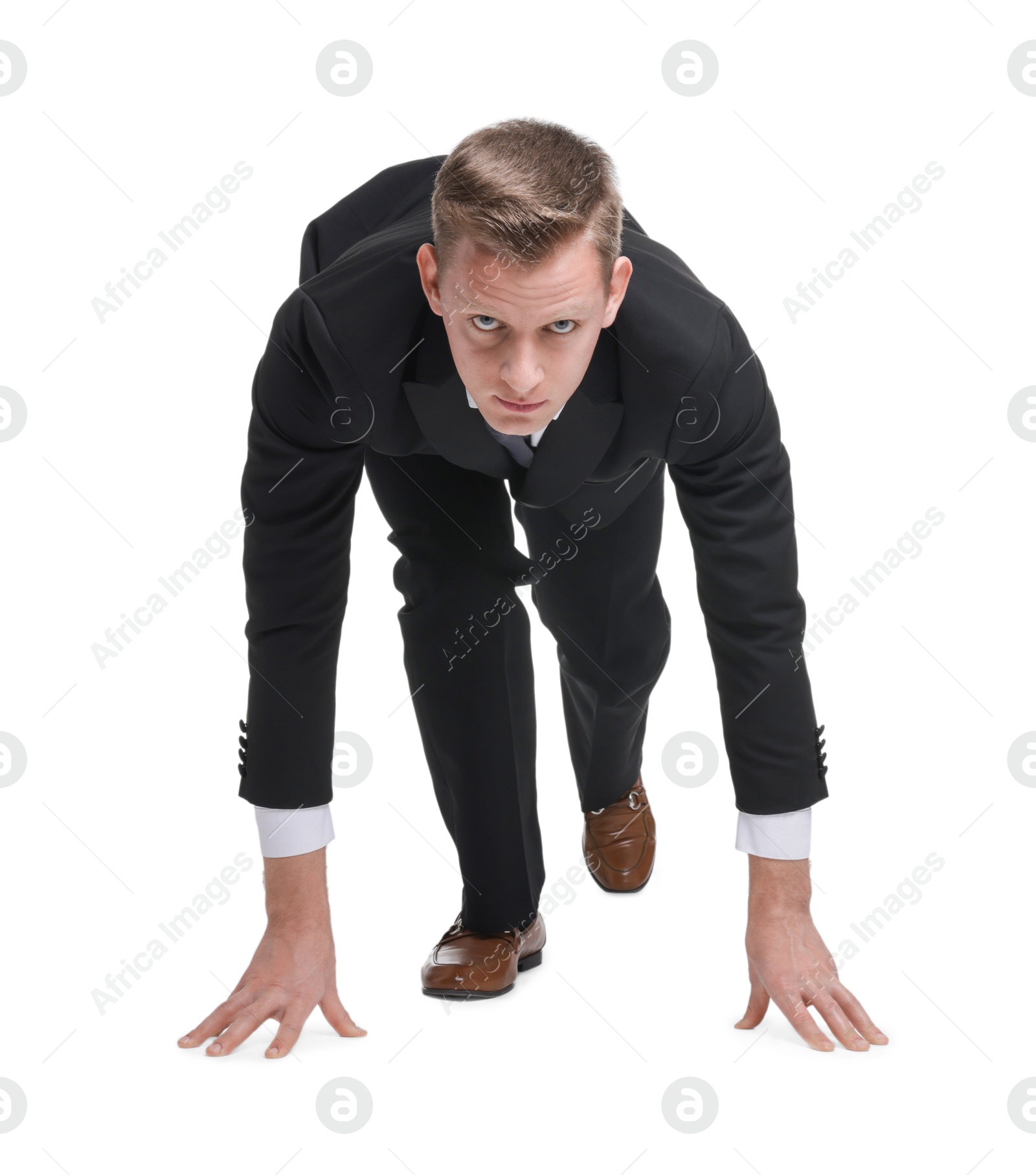 Photo of Businessman in starting position for run ready for competition on white background