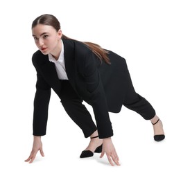 Businesswoman in starting position for run ready for competition on white background