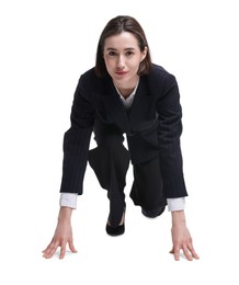 Photo of Businesswoman in starting position for run ready for competition on white background