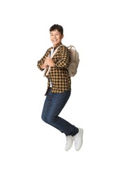 Teenage boy with backpack jumping on white background