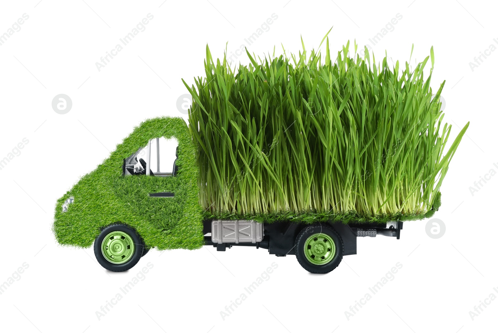 Image of Eco-friendly transportation. Truck covered with green lush grass on white background