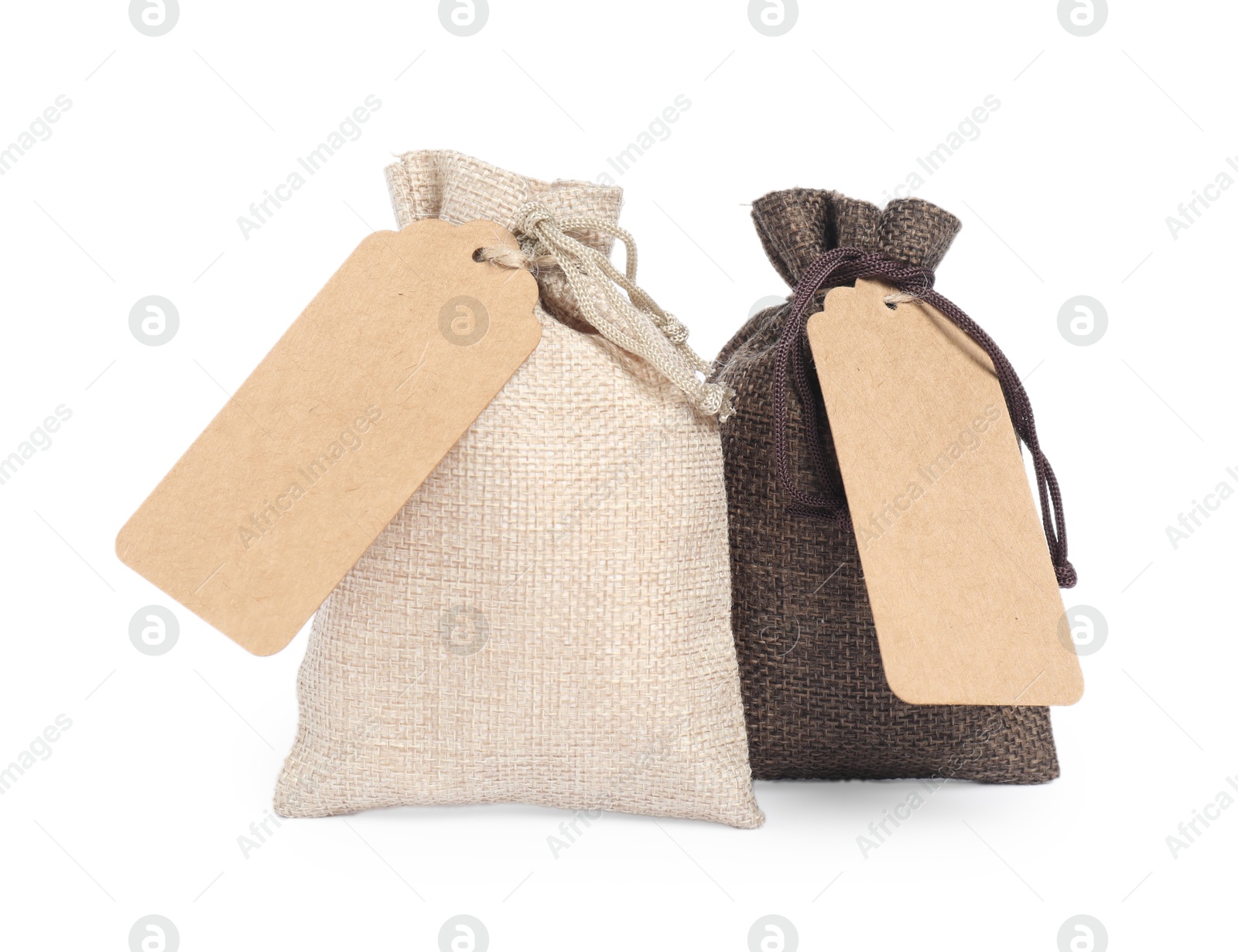 Photo of Burlap bags with tags isolated on white