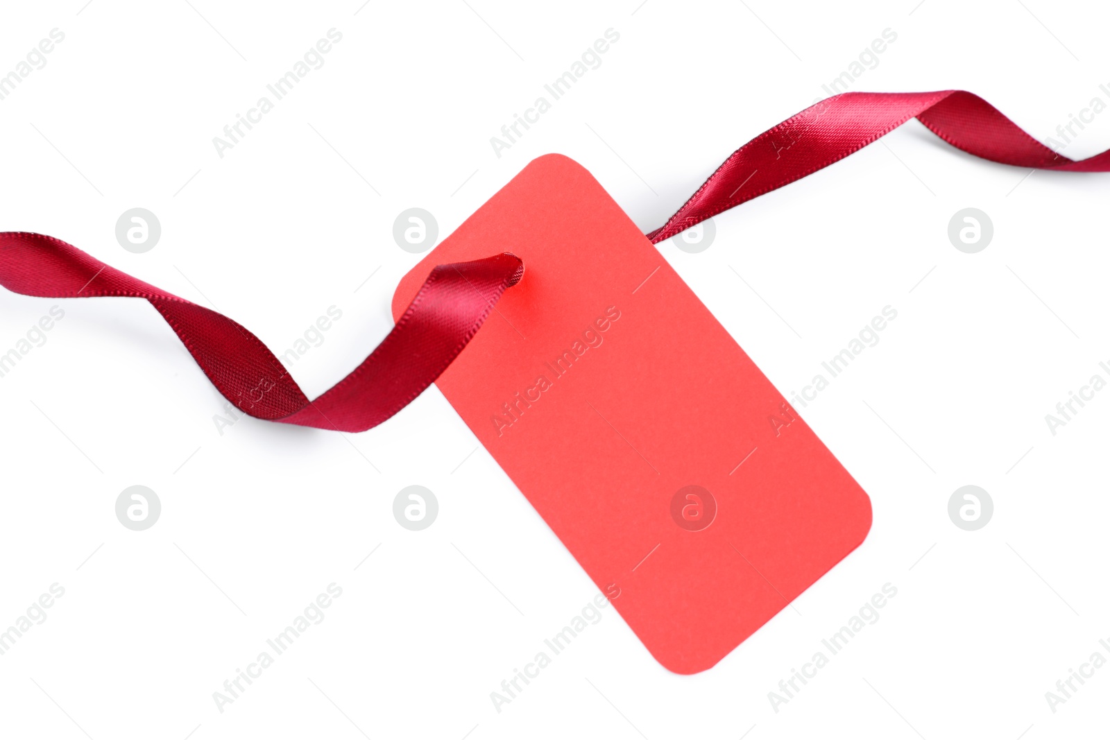 Photo of Blank tag with ribbon isolated on white, top view