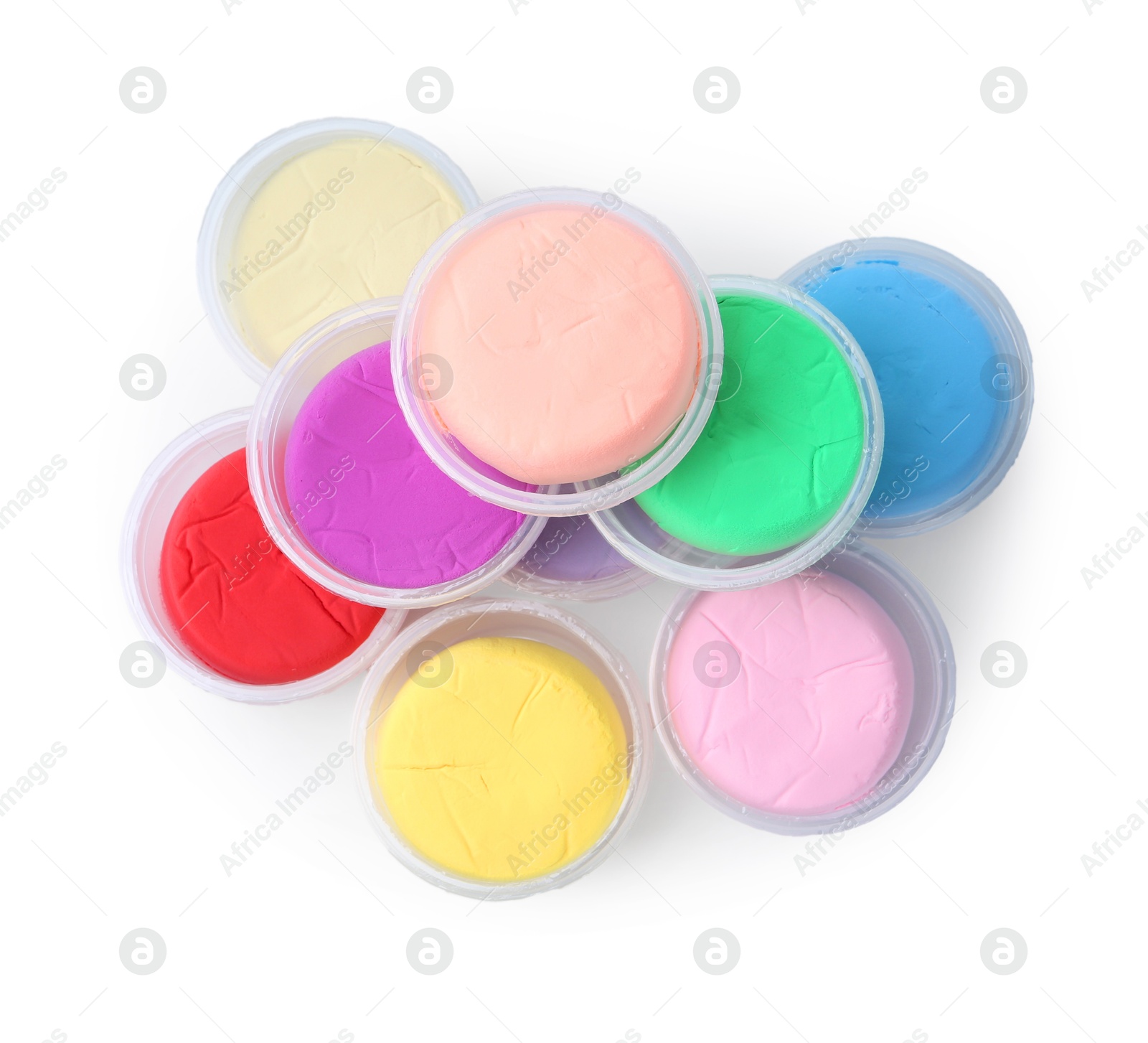 Photo of Different colorful modeling clay in plastic jars isolated on white, top view