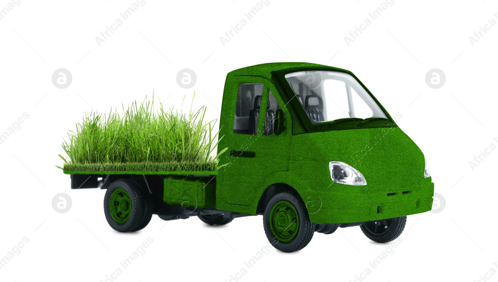 Image of Eco-friendly transportation. Truck covered with green lush grass on white background