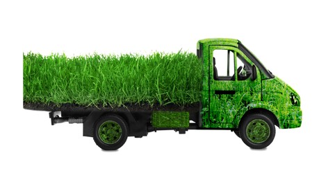 Image of Eco-friendly transportation. Truck covered with green lush grass on white background