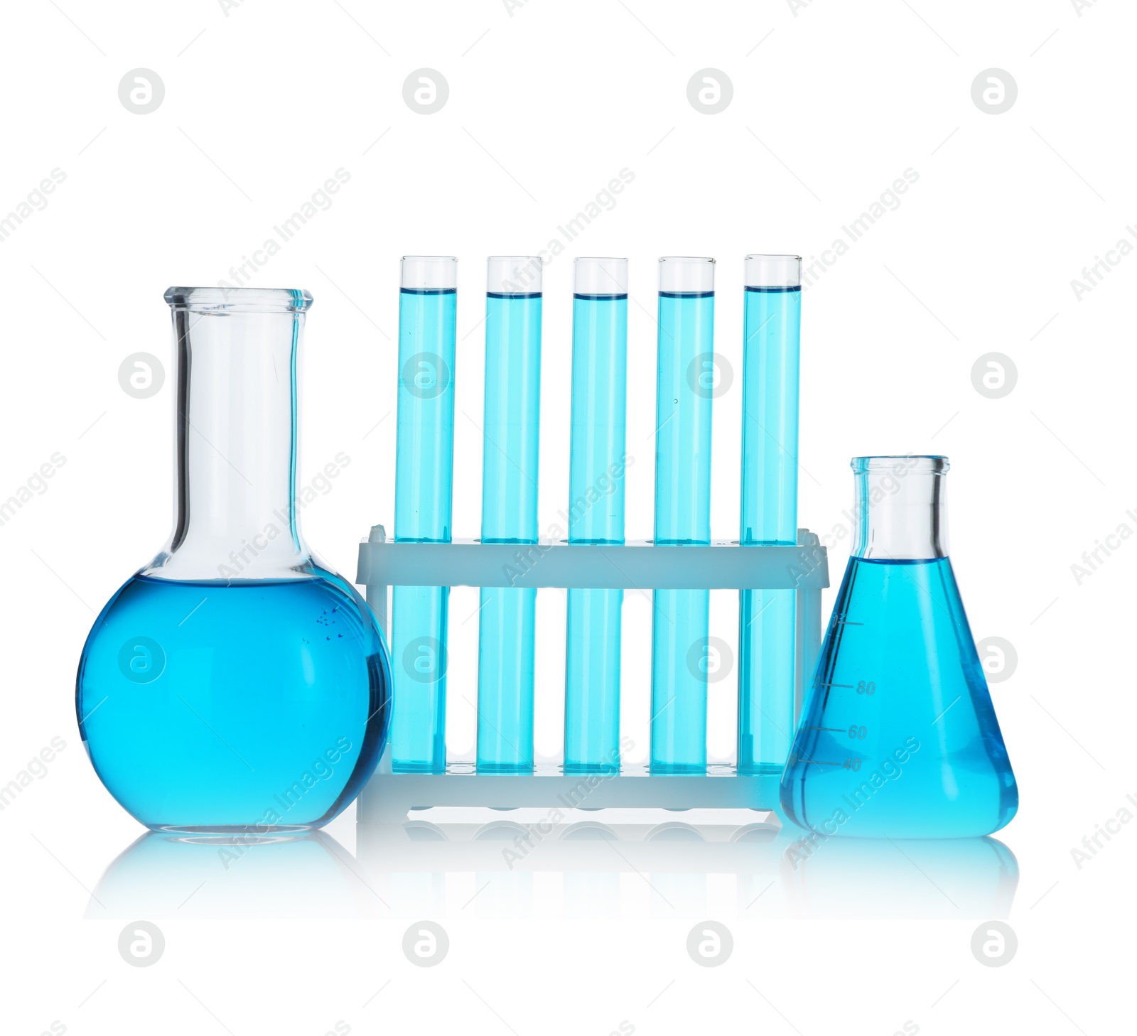 Photo of Laboratory glassware with blue liquid isolated on white