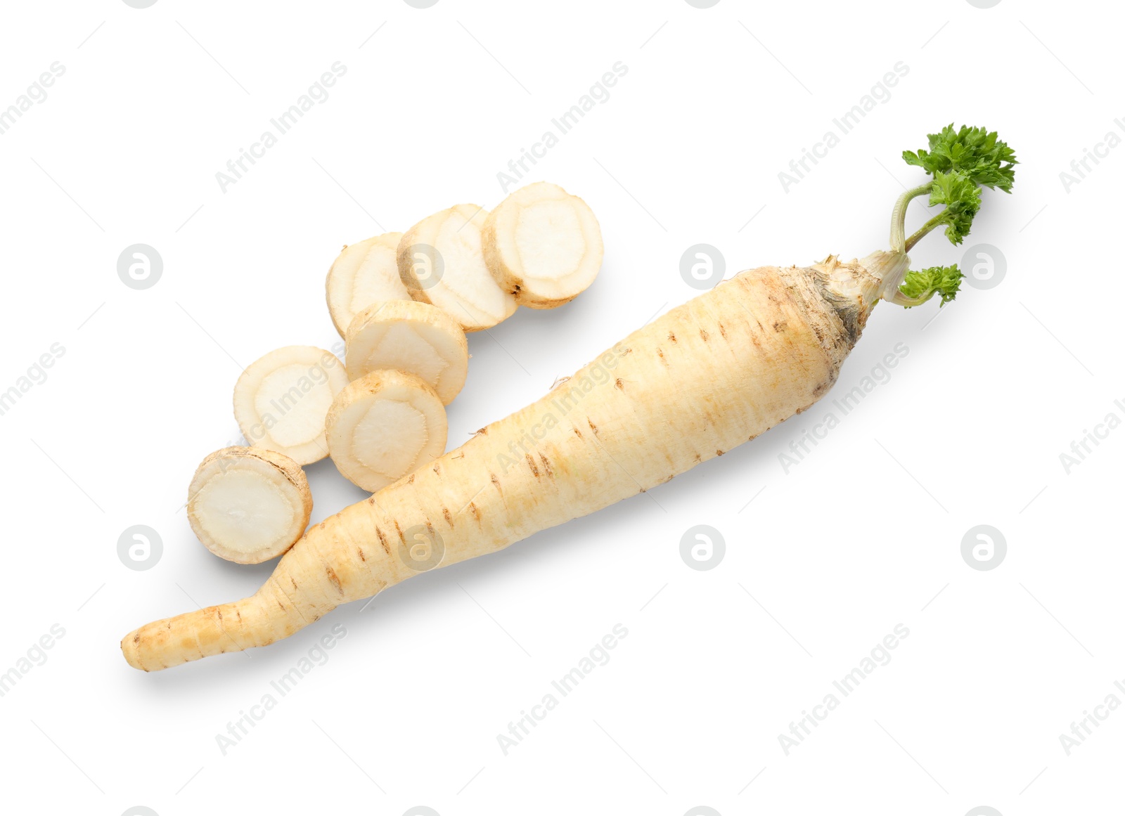 Photo of Whole and cut fresh parsley roots isolated on white, top view