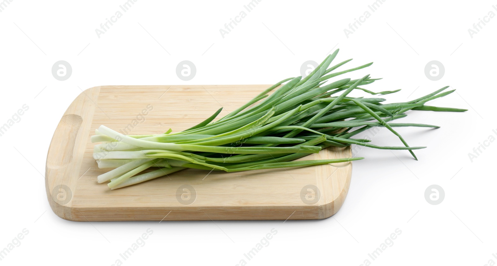 Photo of Wooden cutting board with green onions isolated on white