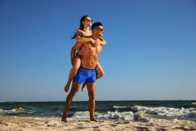 Lovely couple spending time together on beach