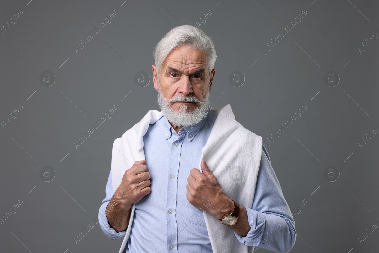 Photo of Portrait of stylish bearded man on grey background