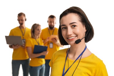 Technical support call center. Team of friendly operators on white background