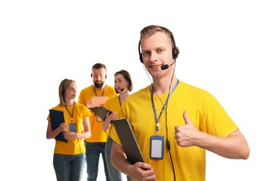 Technical support call center. Team of friendly operators on white background