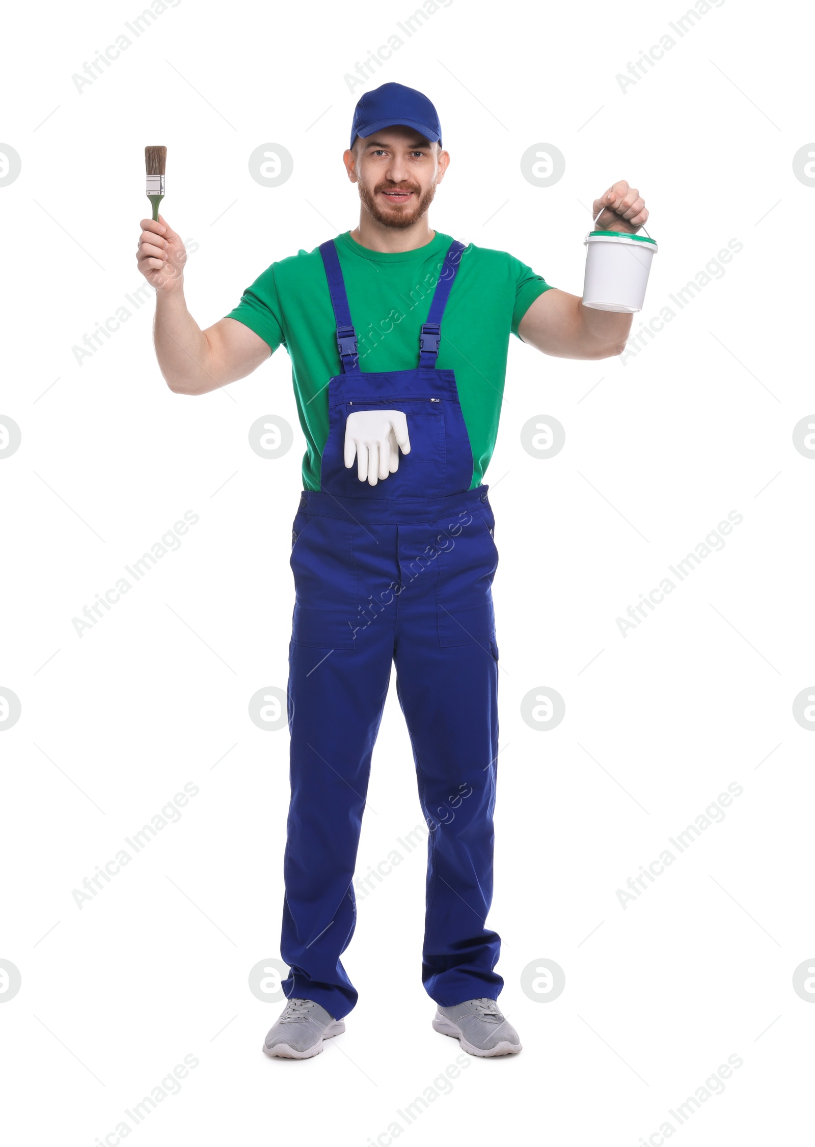 Photo of Professional painter with brush and bucket of paint on white background