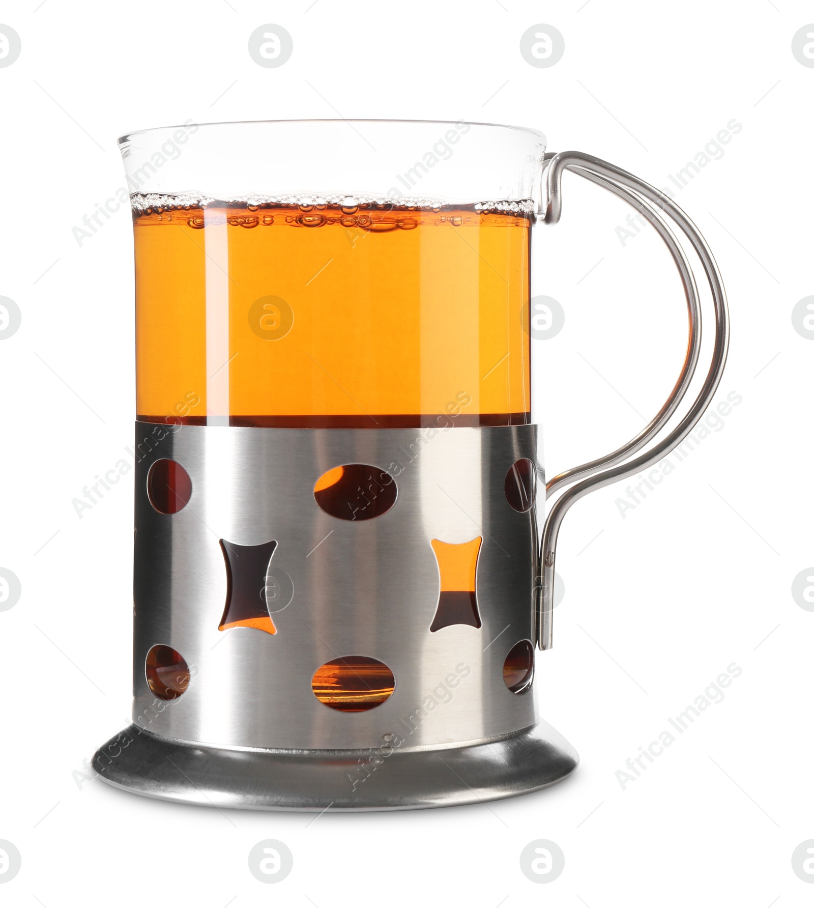 Photo of Glass of aromatic tea in holder isolated on white