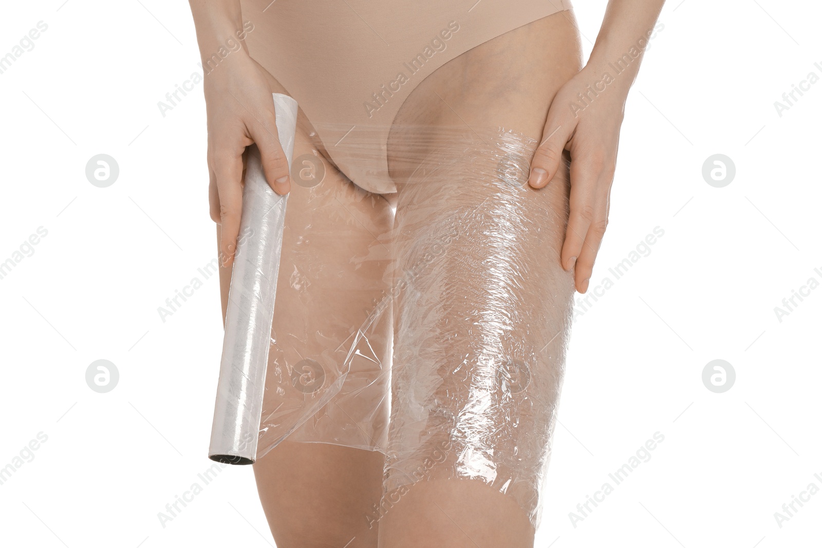 Photo of Woman doing spa body wraps on her leg against white background, closeup