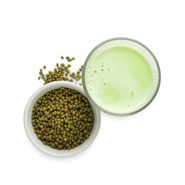 Photo of Fresh mung bean juice in glass and seeds isolated on white, top view