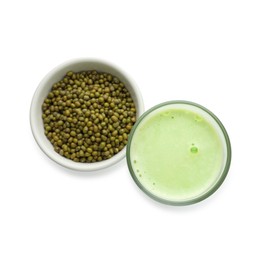 Photo of Fresh mung bean juice in glass and seeds isolated on white, top view
