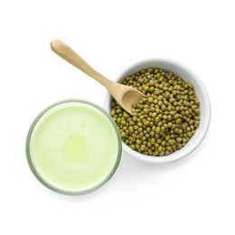 Photo of Fresh mung bean juice in glass and seeds isolated on white, top view