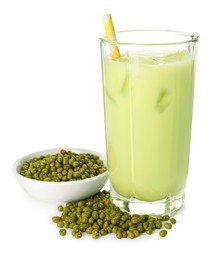 Photo of Fresh mung bean juice in glass and seeds isolated on white
