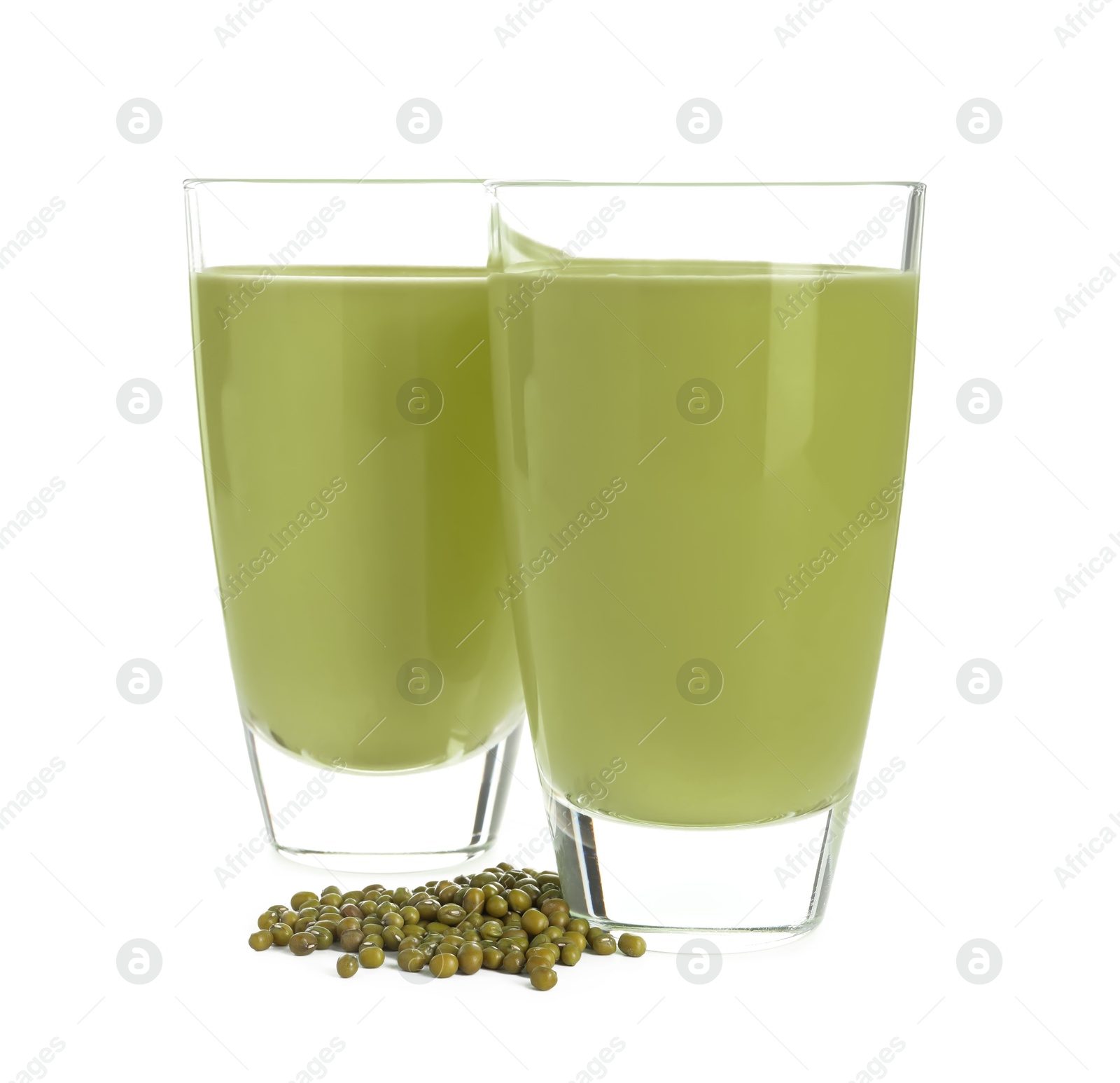 Fresh mung bean juice in glasses and seeds isolated on white Photo of Fresh mung bean juice in glasses and seeds isolated on white